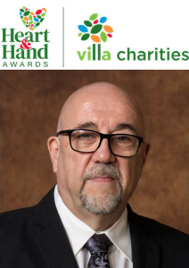 Santo Veltri Award Recipient 2024 Portrait of Santo Veltri, founding partner of Bianchi Presta LLP, recognized with the 2024 Heart & Hand Award by Villa Charities, celebrating his outstanding dedication to community service.